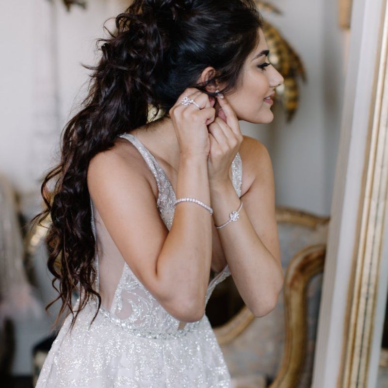 Bride in Berta Bridal gown getting ready on the wedding morning