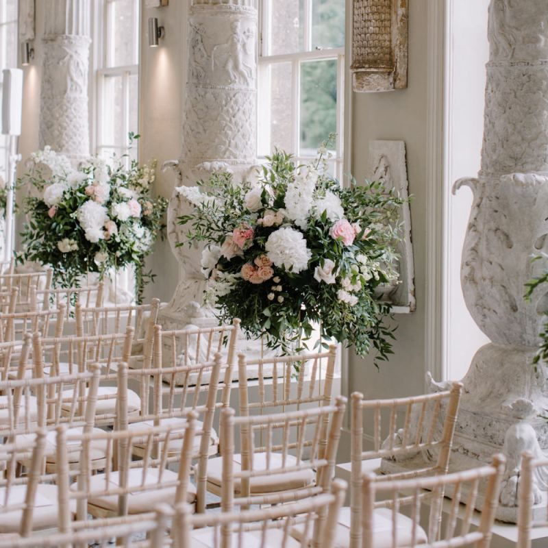 Aisle wedding flowers at Aynhoe Park wedding ceremony