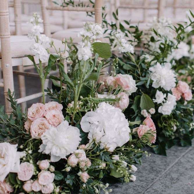 Pink and white aisle wedding flowers for Aynhoe Park ceremony