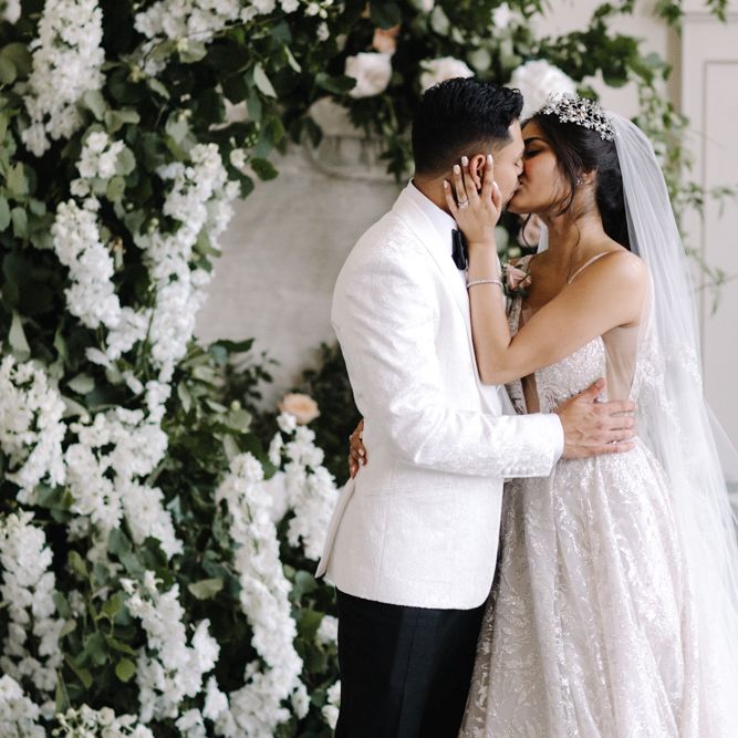 You may now kiss the bride wedding ceremony moment with bride in Berta Bridal gown