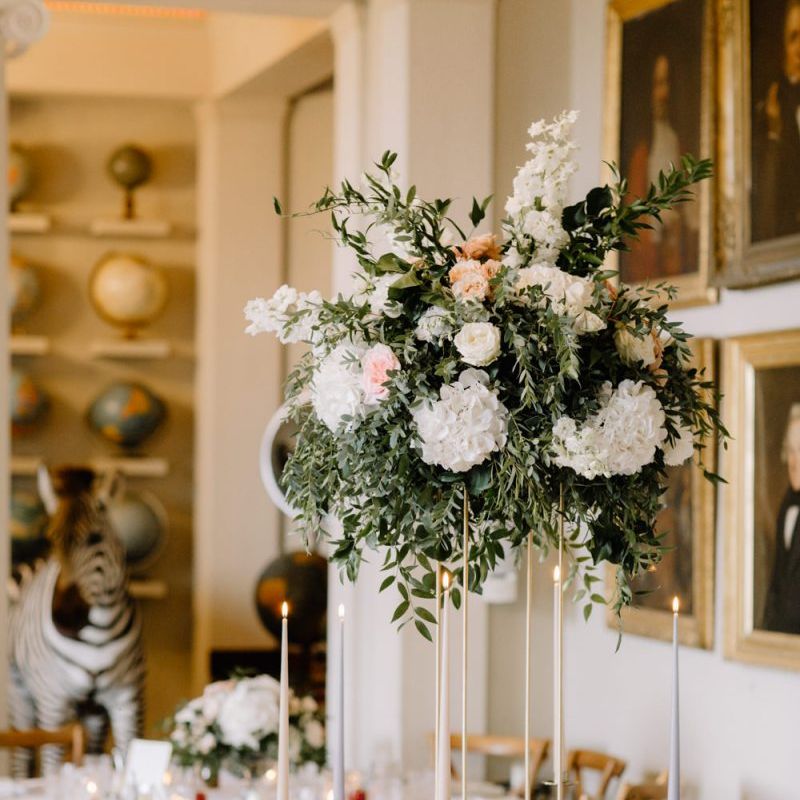 Tall wedding reception floral centrepiece