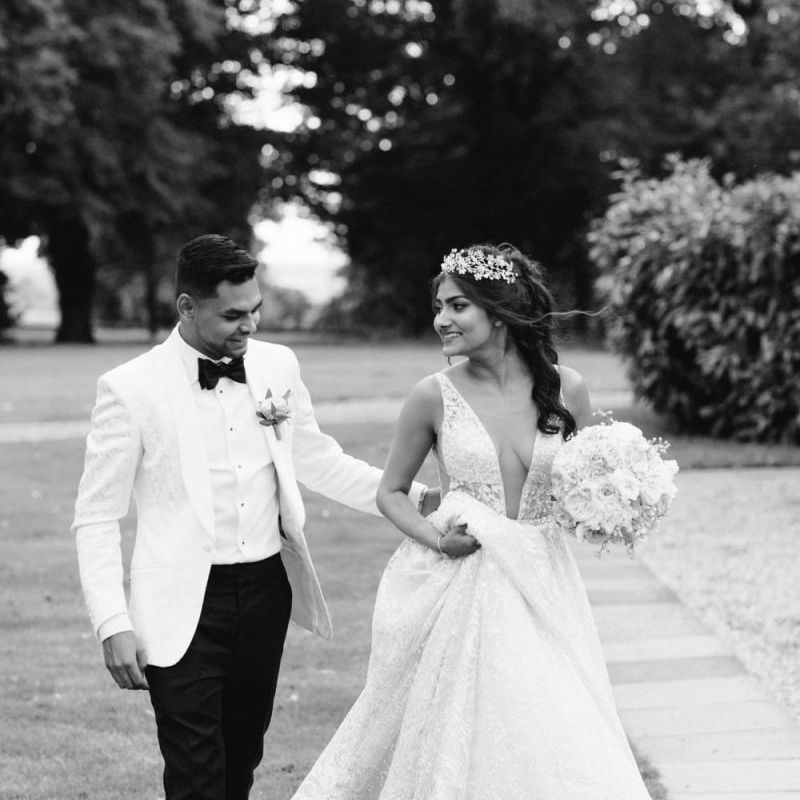 Black and white bride and groom portrait with bride in Berta Bridal gown