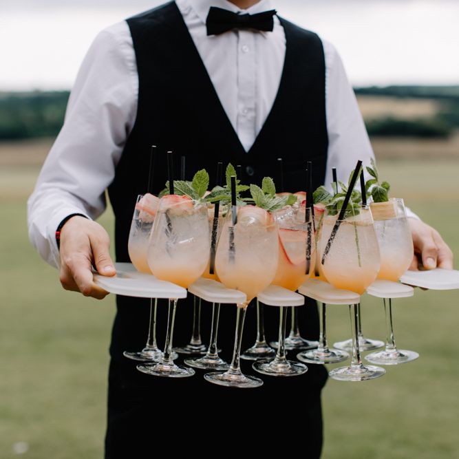 Wedding cocktails for luxury wedding at Aynhoe Park with Berta Bridal gown