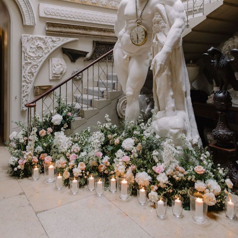 Statue at Aynhoe Park decorated with romantic flowers and candles
