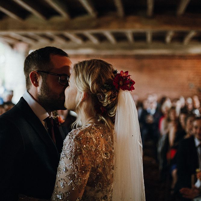 Bride in Bead Embellished Needle &amp; Thread Gown with Cascading Tulle Skirt and Semi Sheer Sleeves | Elbow Length Veil | Bridal Up Do with Pink Hair Flowers | Groom in Check Blue Three Piece Suit by T.M.Lewin with Maroon Tie and Pocket Square | Wedding Ceremony at Pimhill Barn | Mariachi Band and Persian Rug Aisle for Autumn Wedding | Leah Lombardi Weddings