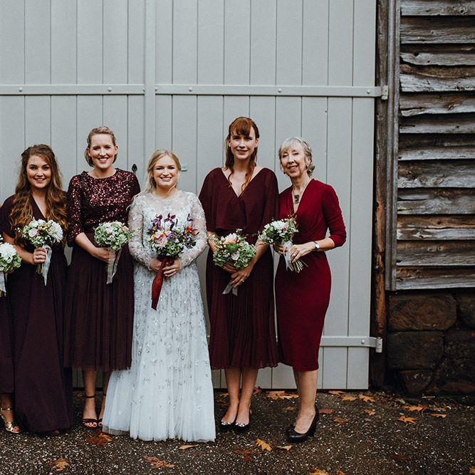 Bride in Bead Embellished Needle &amp; Thread Gown with Cascading Tulle Skirt and Semi Sheer Sleeves | Bridesmaids in Mismatched Maroon Dresses from High Street | Purple, Orange and Pink Flowers with Foliage and Maroon Trailing Ribbon | Mariachi Band and Persian Rug Aisle for Autumn Wedding | Leah Lombardi Weddings