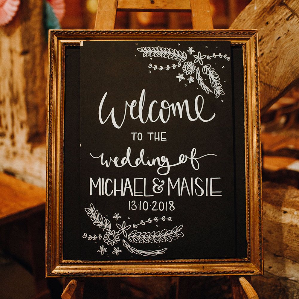Chalkboard Welcome Sign | Mariachi Band and Persian Rug Aisle for Autumn Wedding | Leah Lombardi Weddings