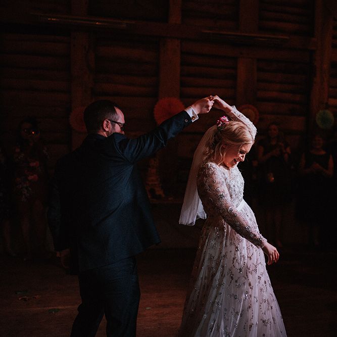 Bride in Bead Embellished Needle &amp; Thread Gown with Cascading Tulle Skirt and Semi Sheer Sleeves | Elbow Length Veil | Bridal Up Do with Pink Hair Flowers | Groom in Check Blue Three Piece Suit by T.M.Lewin with Maroon Tie and Pocket Square | First Dance | Paper Fans | Mariachi Band and Persian Rug Aisle for Autumn Wedding | Leah Lombardi Weddings