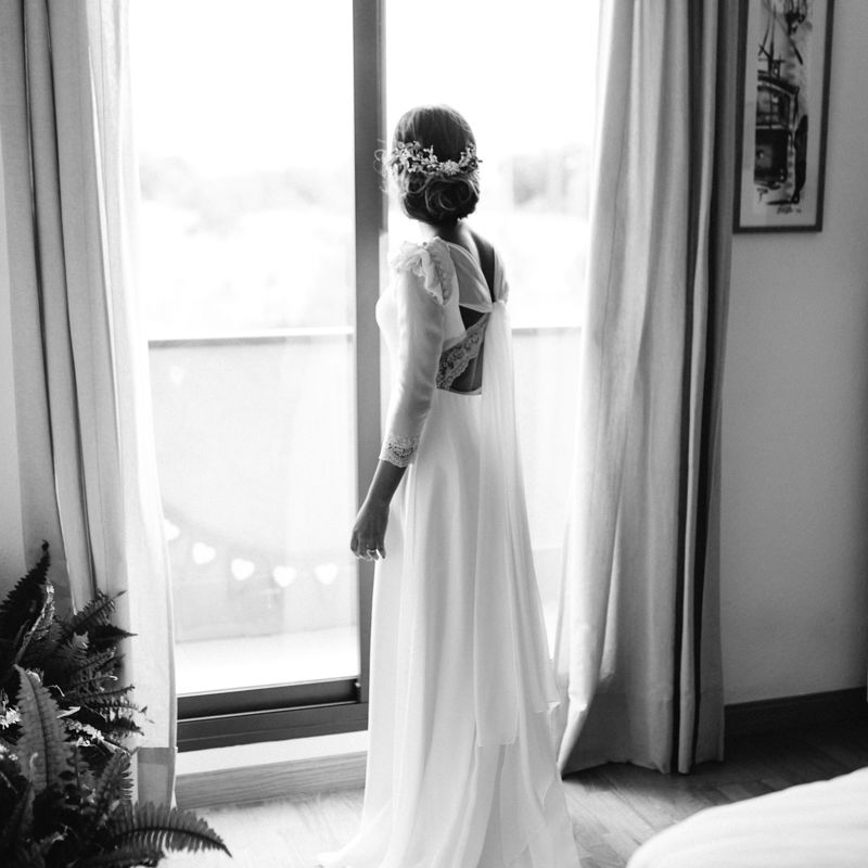 Stylish Wedding Dress with beautiful Back Detail from Beba’s Closet, for a Destination Wedding at Castillo de Viñuelas in Madrid, Spain | Lorena San José Photography