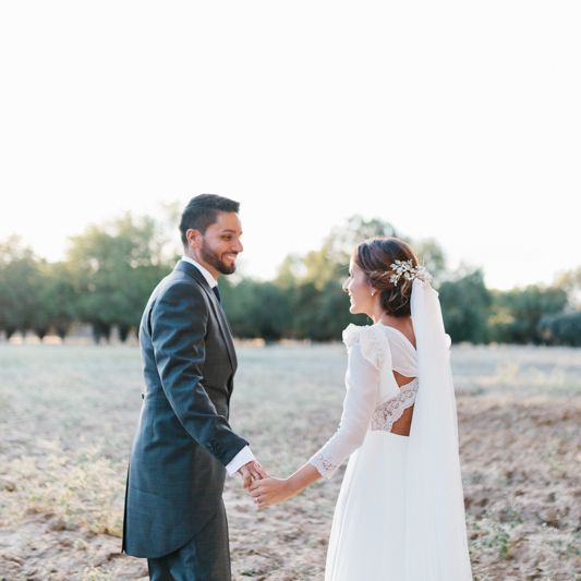 Stylish Wedding Dress with beautiful Back Detail from Beba’s Closet, for a Destination Wedding at Castillo de Viñuelas in Madrid, Spain | Lorena San José Photography