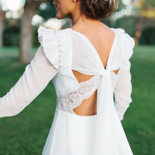 Stylish Wedding Dress with beautiful Back Detail from Beba’s Closet, for a Destination Wedding at Castillo de Viñuelas in Madrid, Spain | Lorena San José Photography