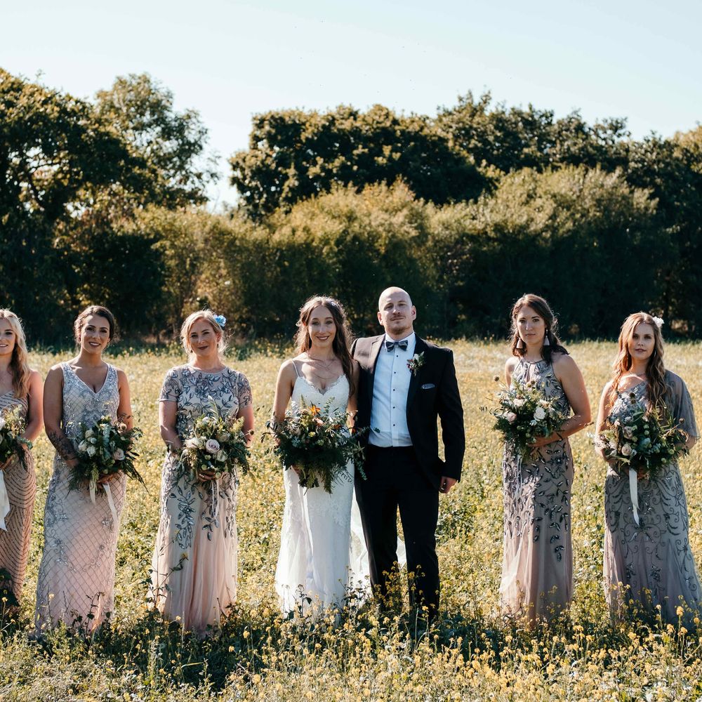 Stunning Bridesmaids Jewelled Dresses. Marquee in Jersey. Foliage Installations. Stationery by Quints of Jersey. Bride Wears Enzoani. Photography by Max Burnett