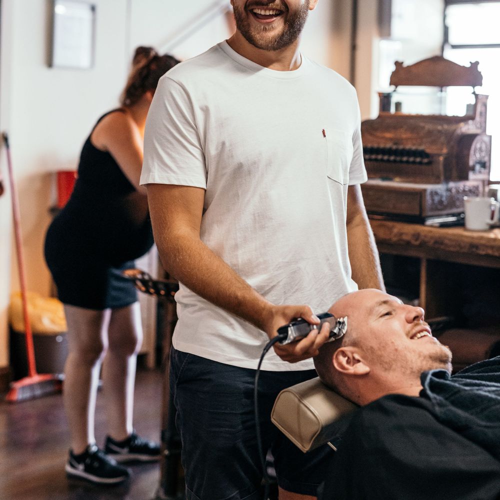 Morning Shave for The Groom. Marquee in Jersey. Foliage Installations. Stationery by Quints of Jersey. Bride Wears Enzoani. Photography by Max Burnett