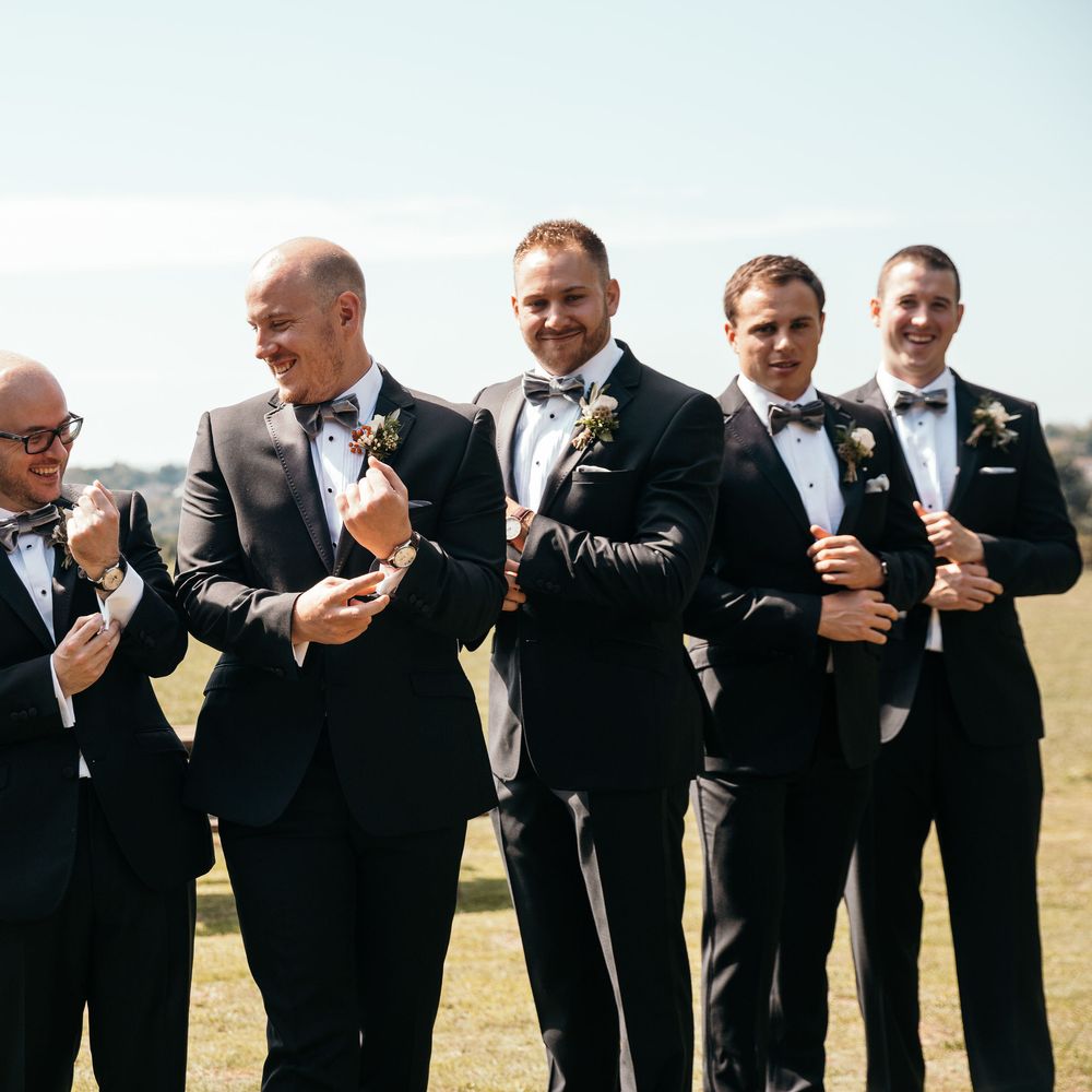 Marquee in Jersey. Foliage Installations. Stationery by Quints of Jersey. Bride Wears Enzoani. Photography by Max Burnett