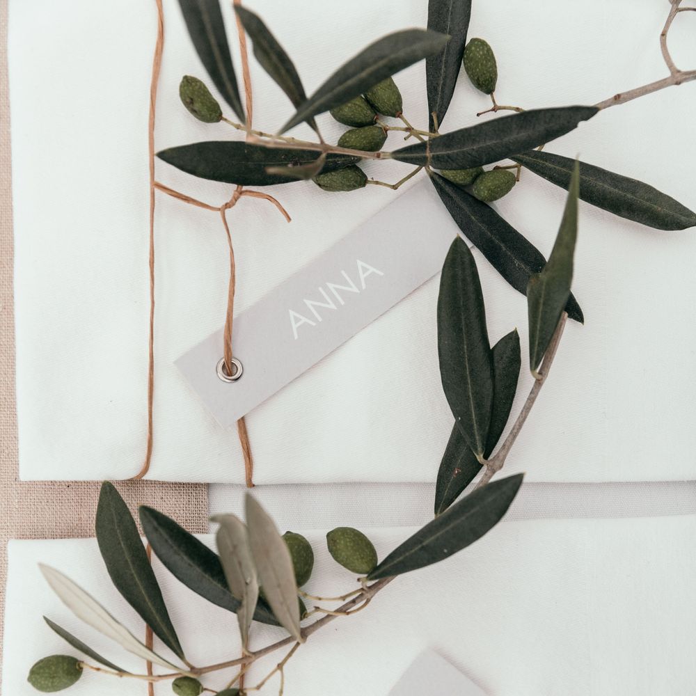 Name Places. Marquee in Jersey. Foliage Installations. Stationery by Quints of Jersey. Bride Wears Enzoani. Photography by Max Burnett