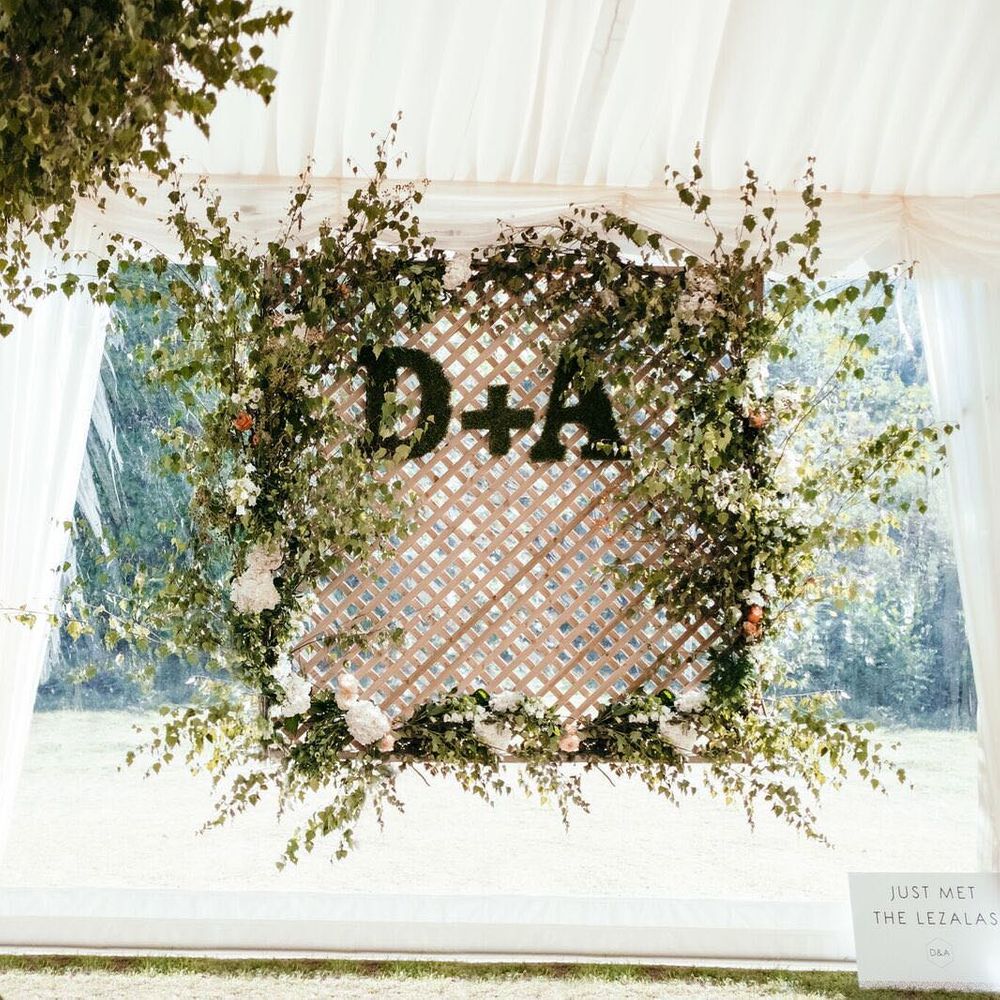 Monogrammed Floral Display Photo Wall. Enchanted Forest Theme | Florals and Foliage Installations by Eden by Claire | Quints of Jersey Stationery | Bride Wears Enzoani | Images by Max Burnett