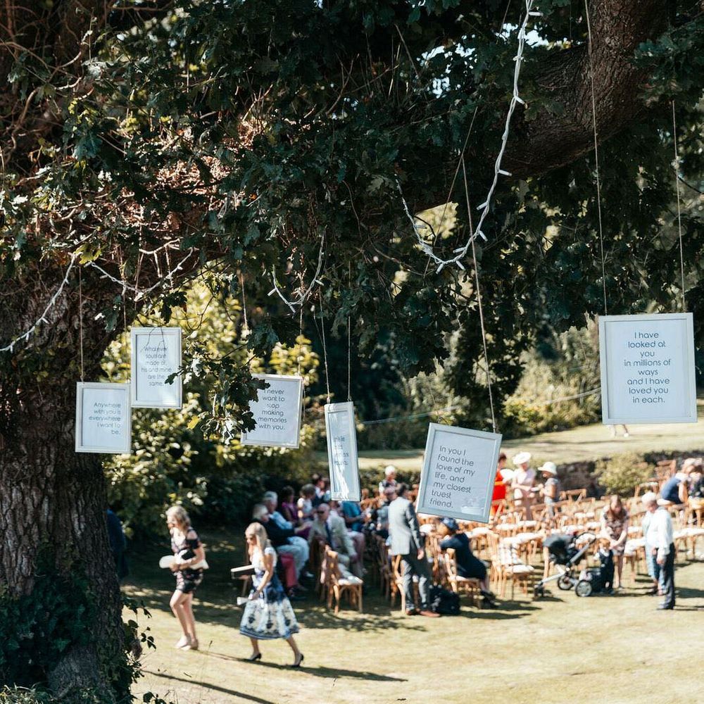 Marquee in Jersey. Foliage Installations. Stationery by Quints of Jersey. Bride Wears Enzoani. Photography by Max Burnett