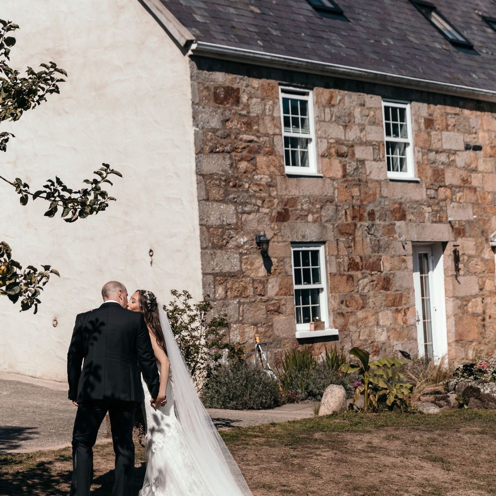 Marquee in Jersey. Foliage Installations. Stationery by Quints of Jersey. Bride Wears Enzoani. Photography by Max Burnett