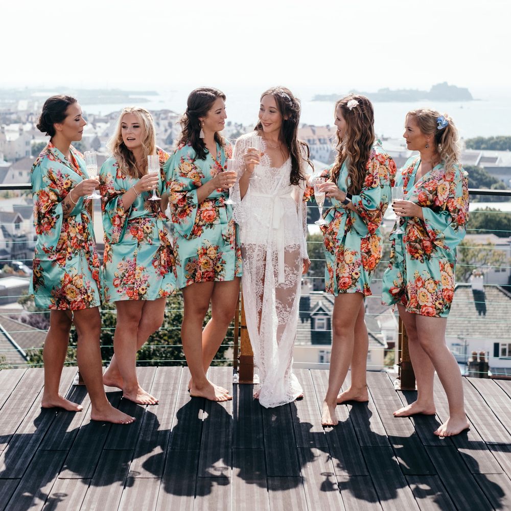Bride and Bridesmaids Dressing Gowns. Marquee in Jersey. Foliage Installations. Stationery by Quints of Jersey. Bride Wears Enzoani. Photography by Max Burnett