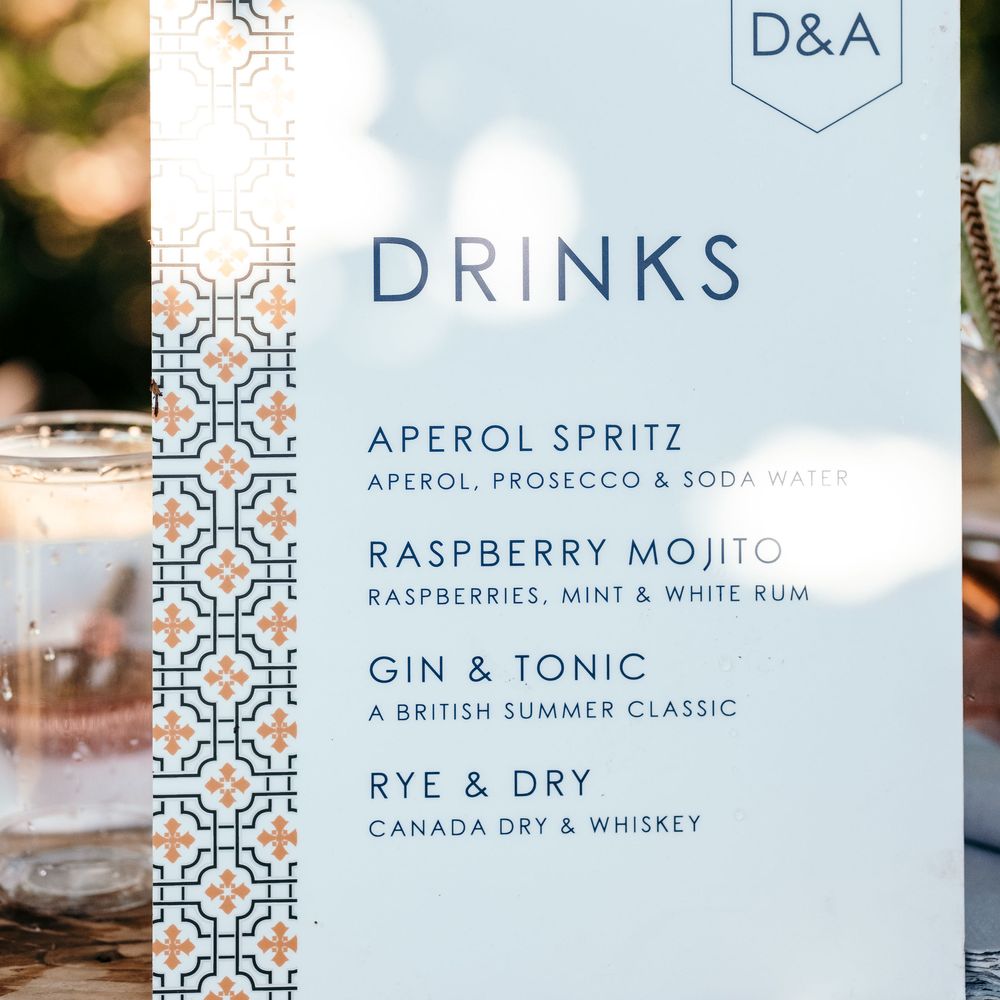 Drinks Menu, On The Day Stationery. Marquee in Jersey. Foliage Installations. Stationery by Quints of Jersey. Bride Wears Enzoani. Photography by Max Burnett