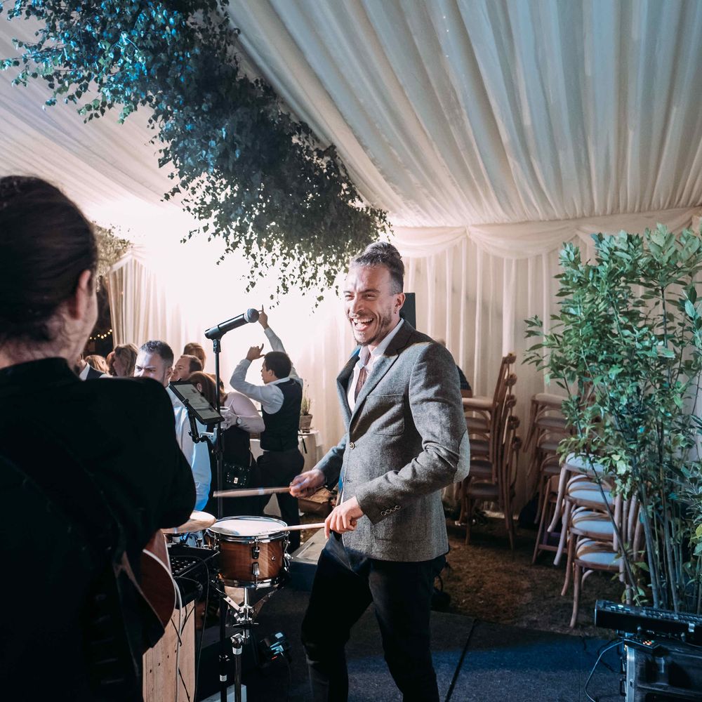 Marquee in Jersey. Foliage Installations. Stationery by Quints of Jersey. Bride Wears Enzoani. Photography by Max Burnett