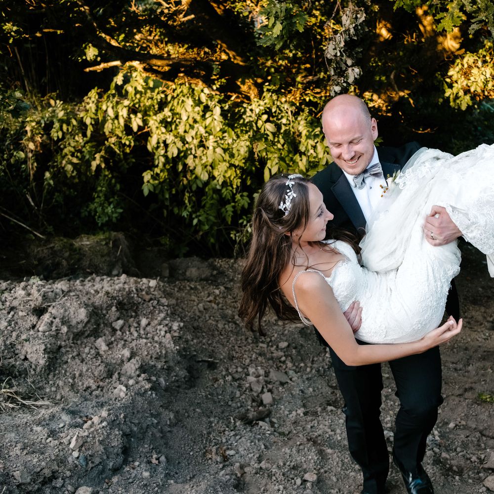Marquee in Jersey. Foliage Installations. Stationery by Quints of Jersey. Bride Wears Enzoani. Photography by Max Burnett