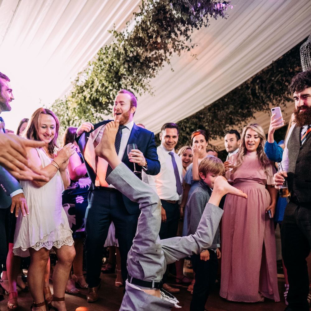 Epic Wedding Reception. Marquee in Jersey. Foliage Installations. Stationery by Quints of Jersey. Bride Wears Enzoani. Photography by Max BurnettMarquee in Jersey. Foliage Installations. Stationery by Quints of Jersey. Bride Wears Enzoani. Photography by Max Burnett