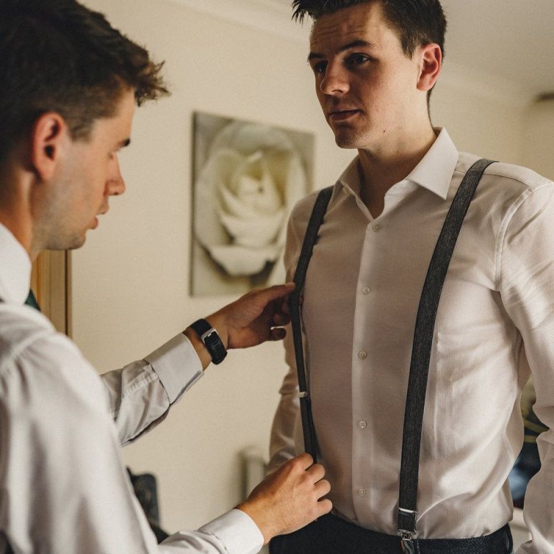 Groom on wedding morning in braces
