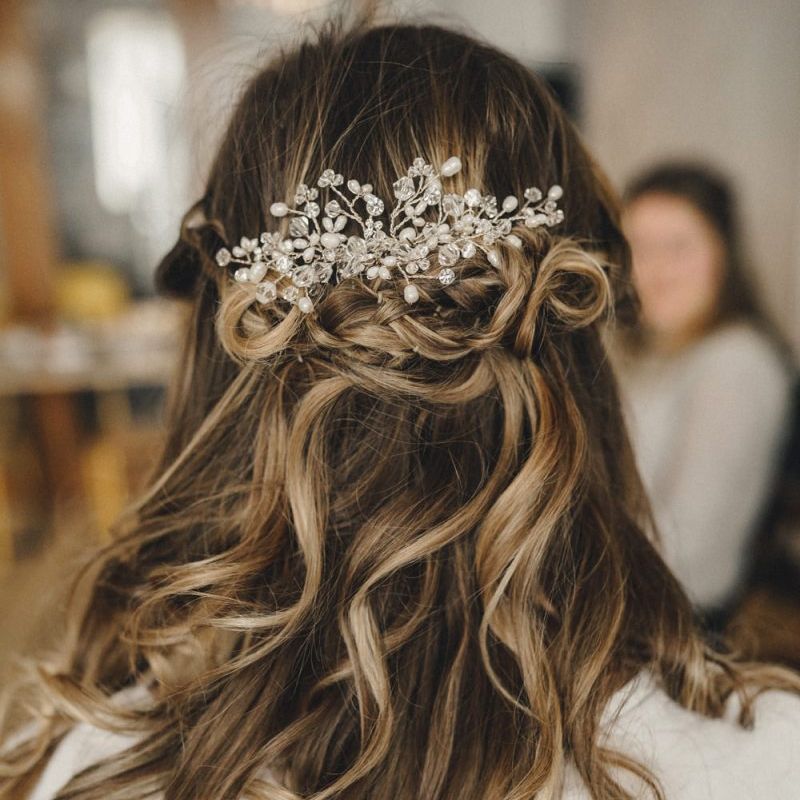 Half up, half down wedding hair with jewelled hair slide