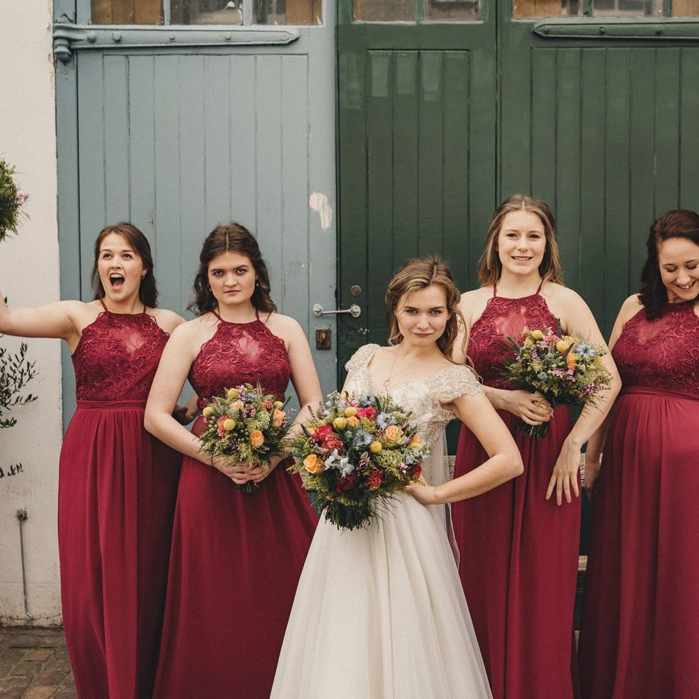 Bridal party portrait with bridesmaids in red lips dresses