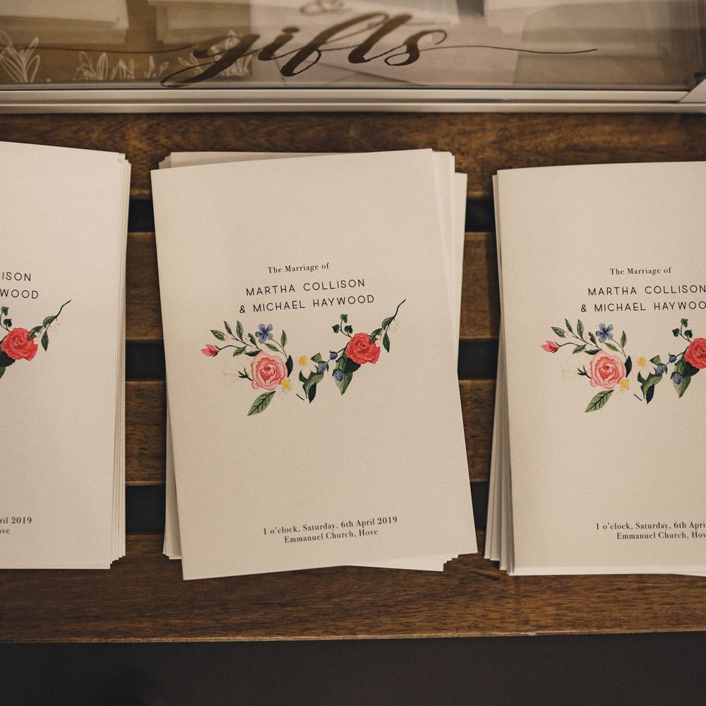 wedding order of service books with floral illustration