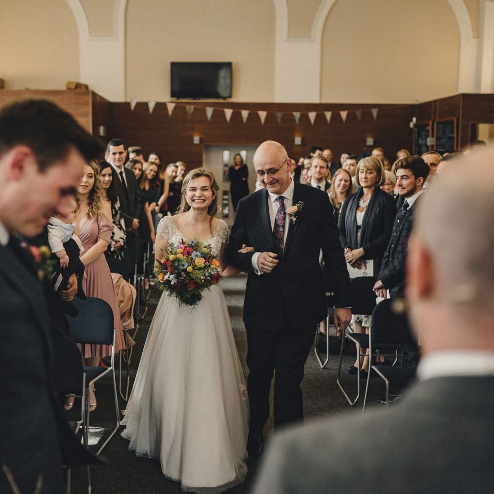 Wedding ceremony bridal entrance in customised Morilee wedding dress