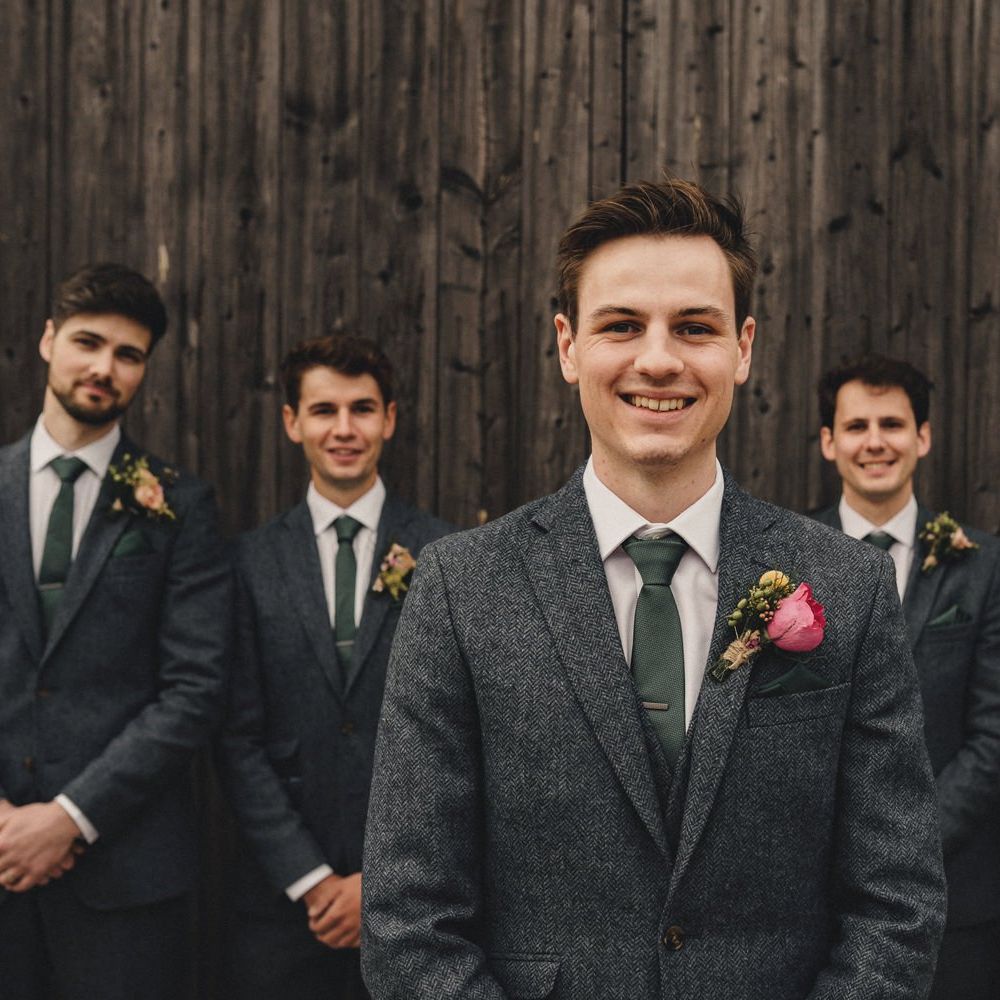 groomsmen in blue wool suits