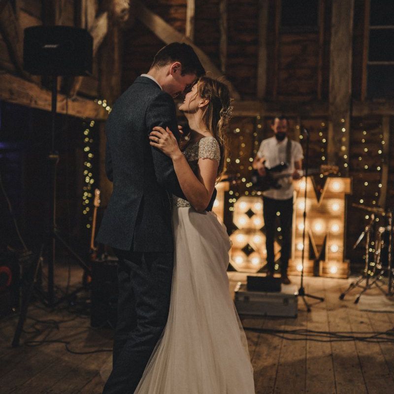 First dance with giant light up letters in the background