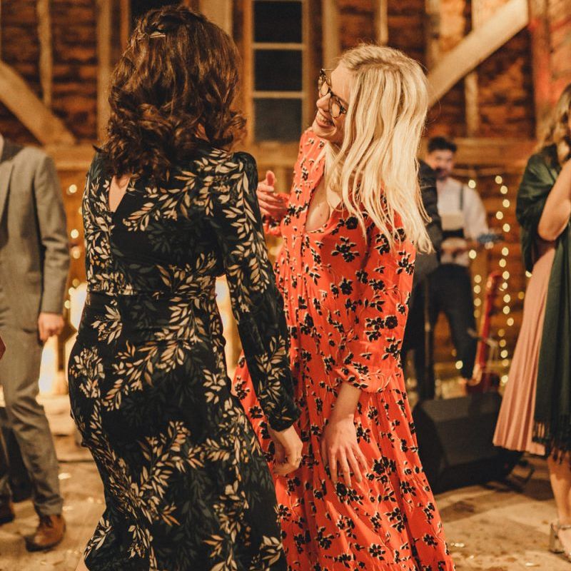 wedding guests in dresses and trainers