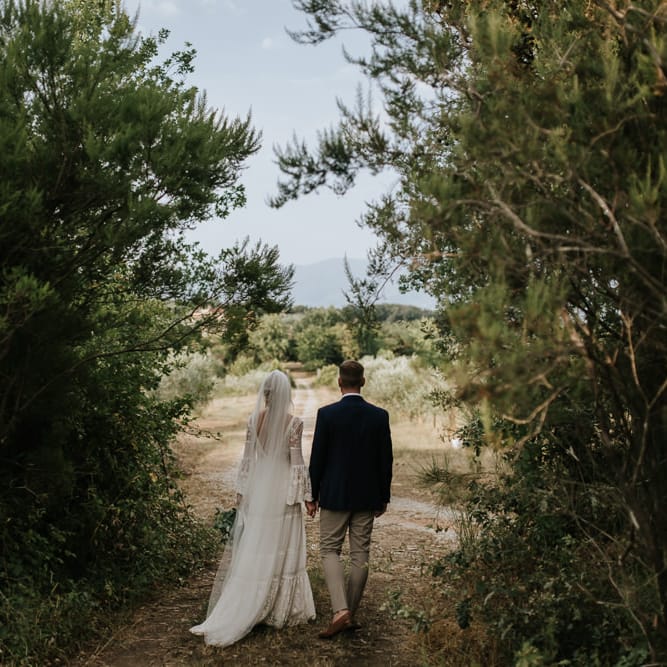 Bride in Spell &amp; the Gypsy Collective Bell Sleeve Wedding Dress | Groom in Chino's &amp; Blazer | Outdoor Bohemian Destination Wedding at La Selva, Tuscany | Damien Milan Photography