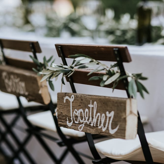 Wooden Together Chair Back Decor | Festoon Lit Outdoor Reception | Bohemian Destination Wedding at La Selva, Tuscany | Damien Milan Photography