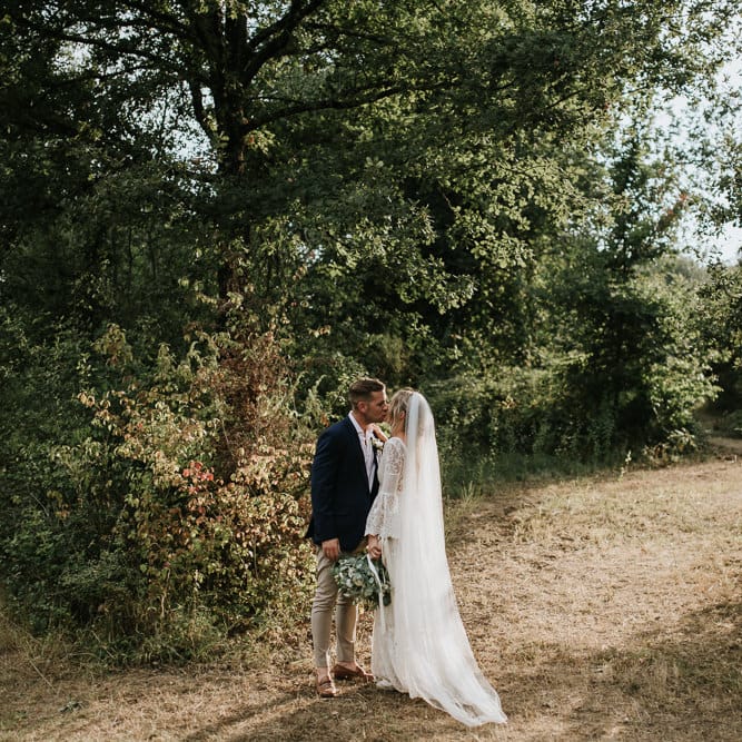 Bride in Spell &amp; the Gypsy Collective Bell Sleeve Wedding Dress | Groom in Chino's &amp; Blazer | Outdoor Bohemian Destination Wedding at La Selva, Tuscany | Damien Milan Photography