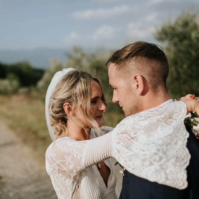 Bride in Spell &amp; the Gypsy Collective Bell Sleeve Wedding Dress | Groom in Chino's &amp; Blazer | Outdoor Bohemian Destination Wedding at La Selva, Tuscany | Damien Milan Photography