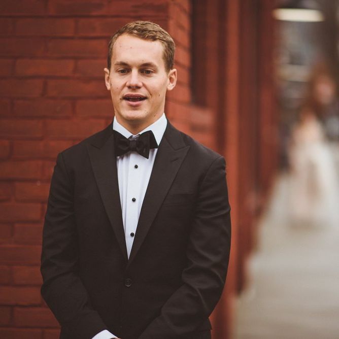Groom waits to see bride at First Look