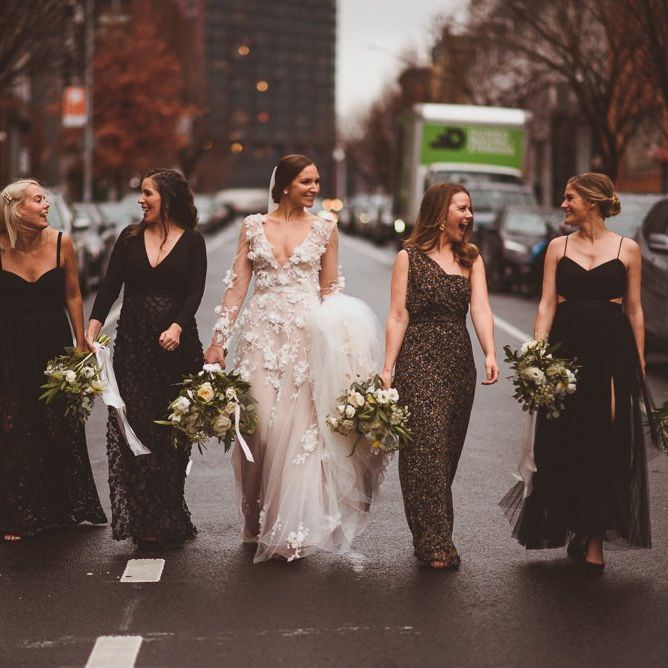 Bride with bridesmaids walk down the streets of Brooklyn