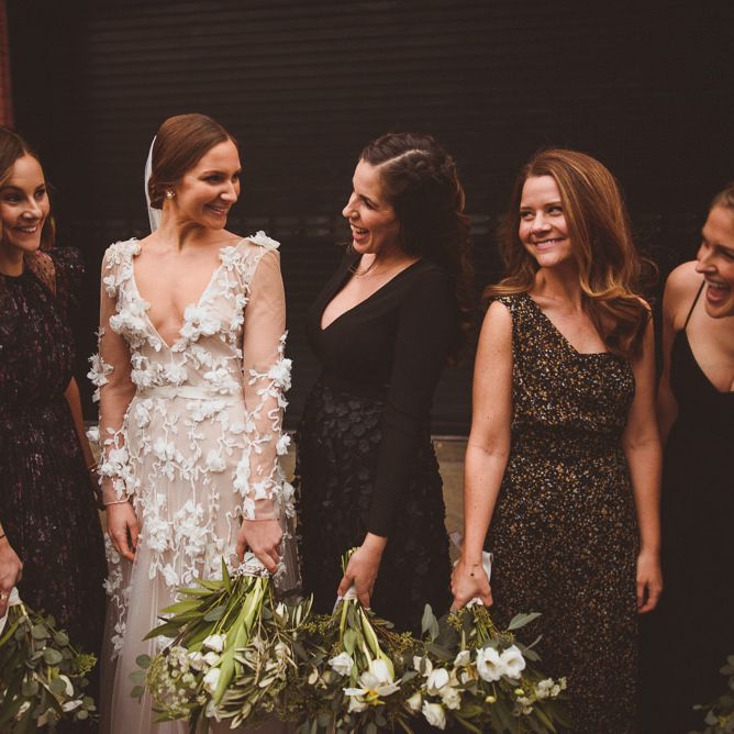 Bride in Marchesa bridal gown with bridesmaids in mismatched dresses