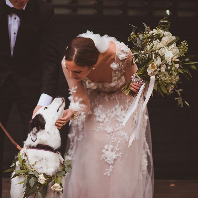 Bride in Marchesa wedding dress with her pet dog