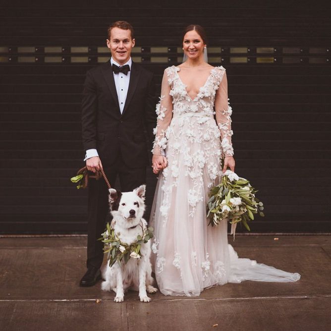 Bride and groom with family pet dog at their wedding in New York