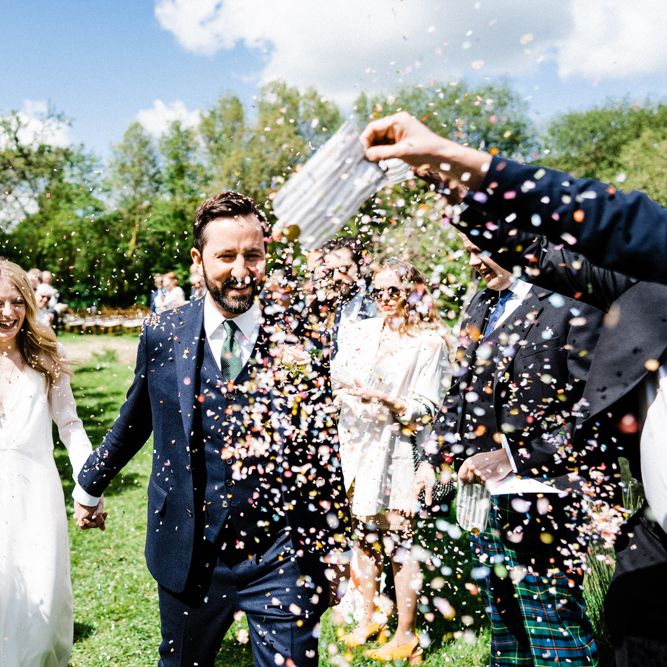 Confetti Moment with Bride in Andrea Hawkes Wedding Dress