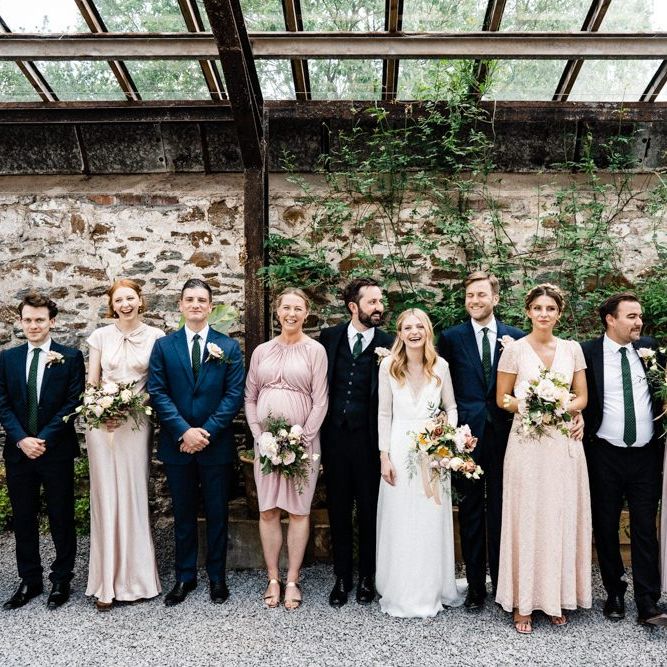 Wedding Party Portrait with Bridesmaids in Different Pink Dresses