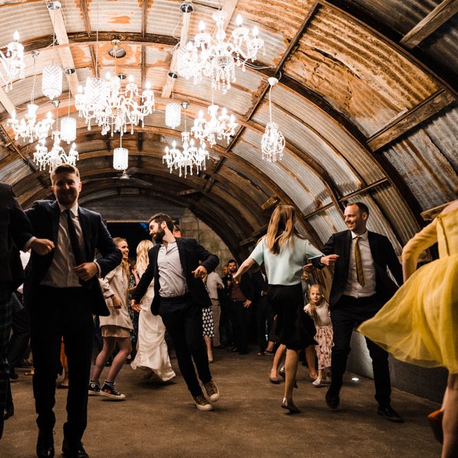 Chandelier Lit Cowshed Wedding Reception
