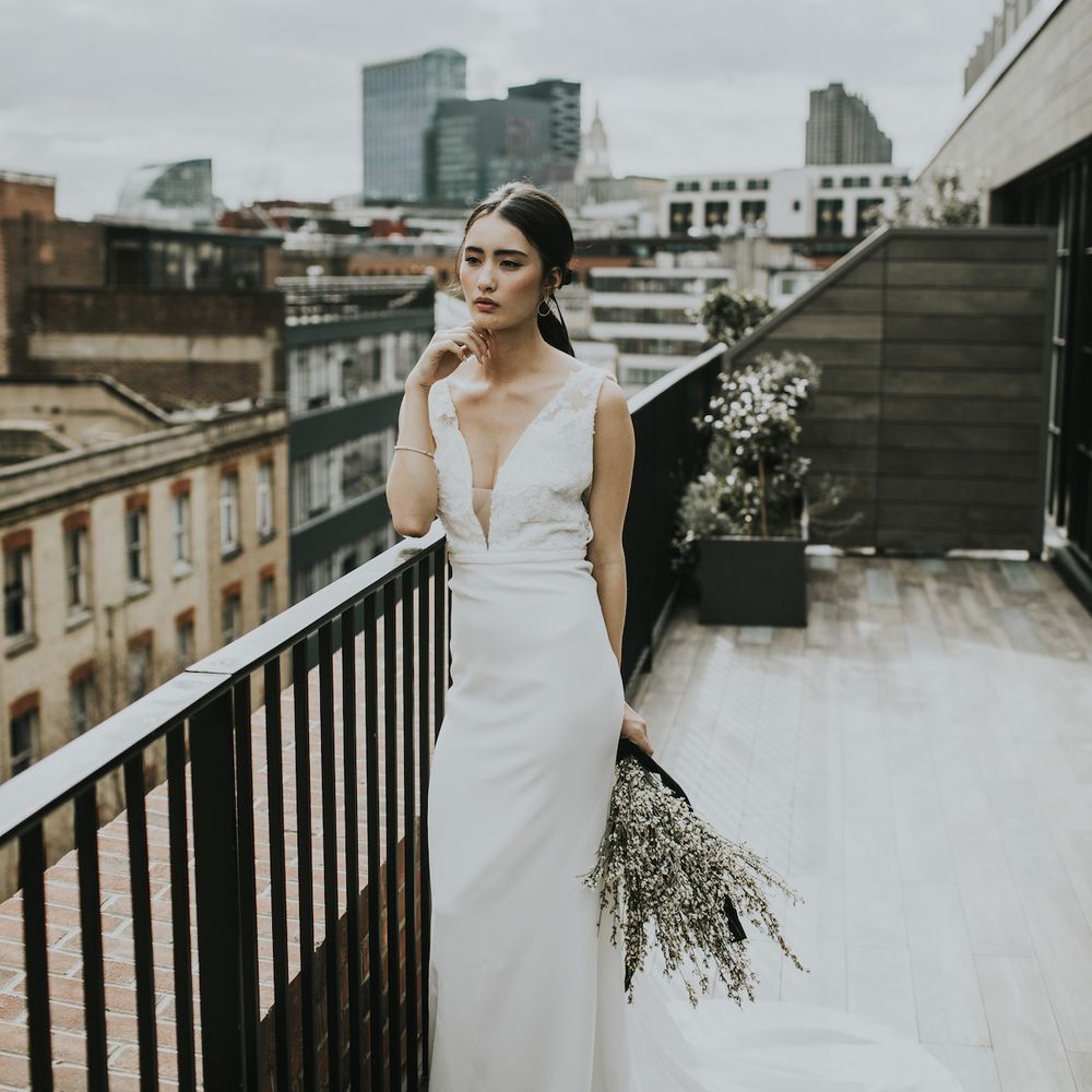 Bride in Fitted Marquis Bridal Gown with White Genista Bouquet | Minimalist Monochrome Inspiration with Anemone's &amp; White Genista Flowers styled by The Bijou Bride | Igor Demba Photography | Gione da Silva  Film