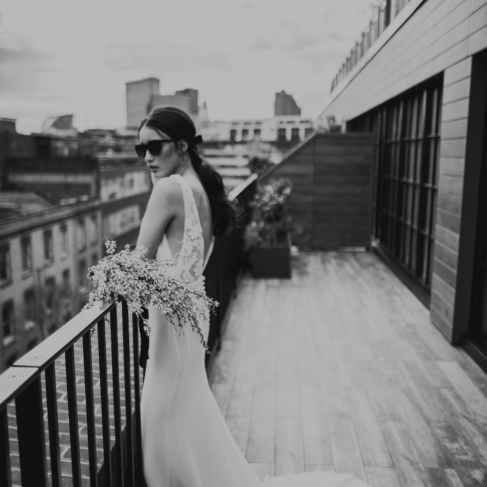 Bride in Fitted Marquis Bridal Gown with White Genista Bouquet | Minimalist Monochrome Inspiration with Anemone's &amp; White Genista Flowers styled by The Bijou Bride | Igor Demba Photography | Gione da Silva  Film