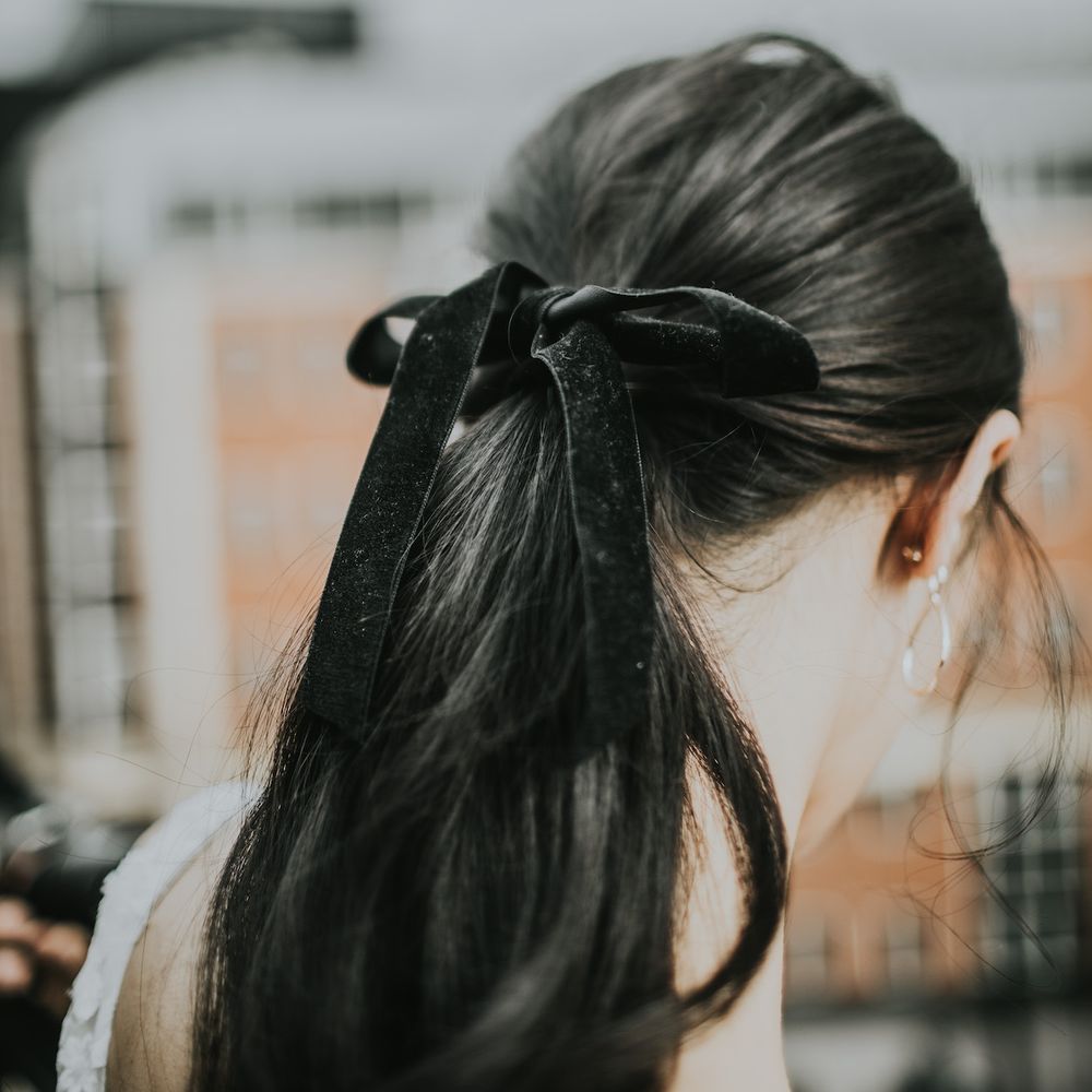 Bridal Ponytail with Black Velvet Ribbon | Minimalist Monochrome Inspiration with Anemone's &amp; White Genista Flowers styled by The Bijou Bride | Igor Demba Photography | Gione da Silva  Film